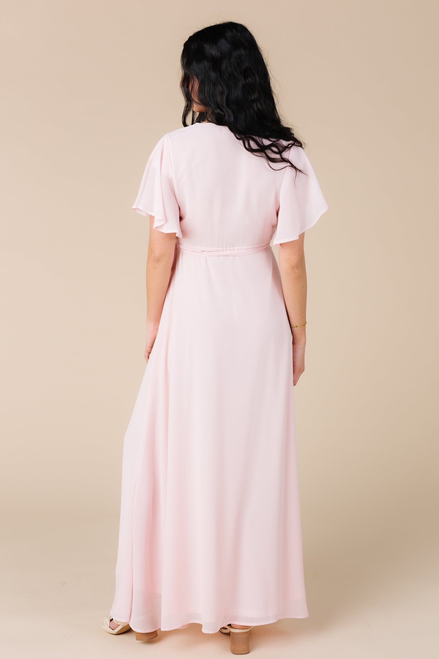 Back view of lt pink maxi dress with short flutter sleeves